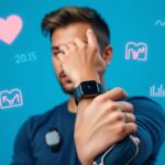 Person wearing multiple health wearables including smartwatch and fitness tracker